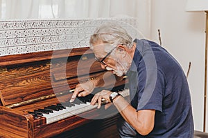 Senior Elderly musician enjoy happy playing music with Piano prevent Alzheimer disease