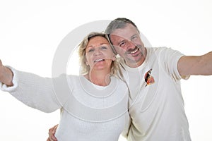Senior elderly woman man couple makes cell selfie photo with mobile phone on white background