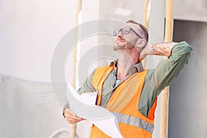 senior engineer worker hard work tired neck strain painful from muscle cramp injury during work in construction site