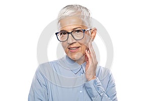 Senior Expert! Businesswoman with glasses in a blue shirt and gray white hair and glasses