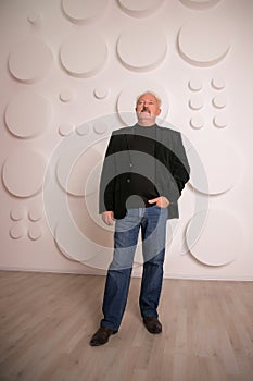 Senior expertise gray hair businessman posing interior white