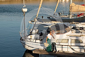 Senior Family Couple Standing Near Luxury Yacht Embracing Outdoor