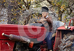 Senior farmer plowing