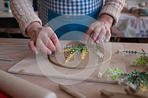 Senior female artisan creating handmade ceramics in pottery studio