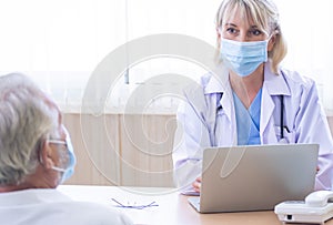 Senior female doctor giving consultation to a patient