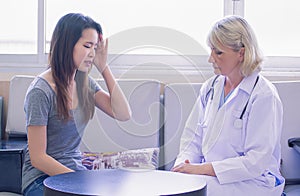 Senior female doctor giving consultation to a patient