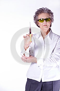 Senior female doctor with syringe