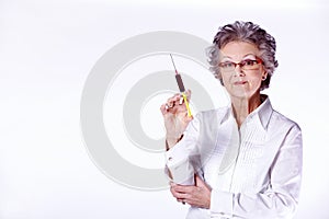 Senior female doctor with syringe