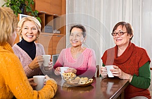 Senior female friends drinking coffee