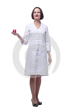 senior female medic with a laboratory bottle. isolated on a white background.