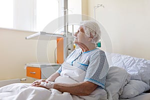 Senior female patient in hospital bed