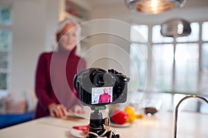 Senior Female Vlogger Making Social Media Video About Cooking For The Internet At Home