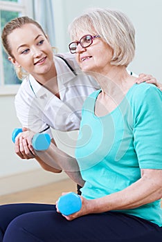 Senior Female Working With Physiotherapist