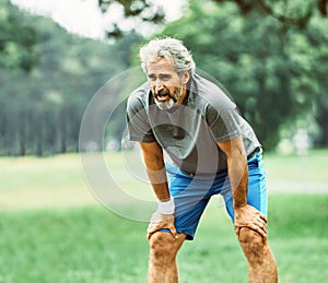 senior fitness man active sport exercise running jogging tired exhausted healthy runner fit jogger dehydration outdoor