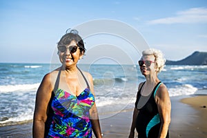 Senior friends chilling on the beach