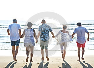 Senior friends enjoying the beach in the summertime