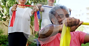 Senior friends exercising with resistance band 4k