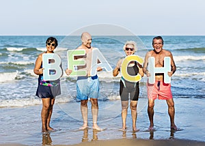 Senior friends having fun at the beach