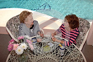 Senior friends playing cards