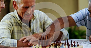 Senior friends playing chess 4k