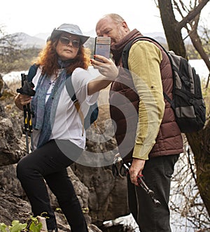 senior friends tourists outdoor adventure together on mediterranian sea