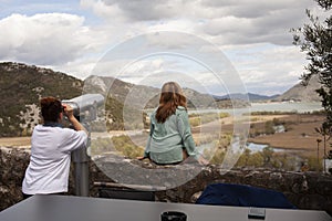 senior friends tourists outdoor adventure together on mediterranian sea