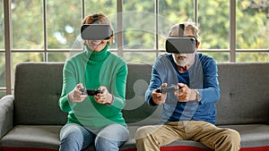 Senior gamers playing VR videogame together