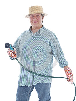 Senior gardener with hose