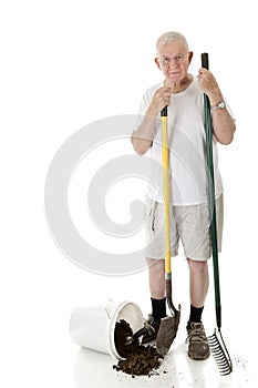 Senior Gardener with spilled Bucket
