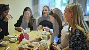 Senior girls having breakfast in the school canteen.