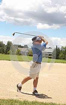 Senior golfer playing golf