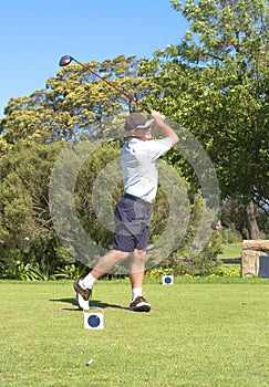 Senior golfer playing golf