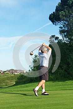 Senior golfer playing golf