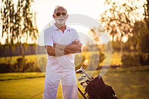 Senior golfer standing on court