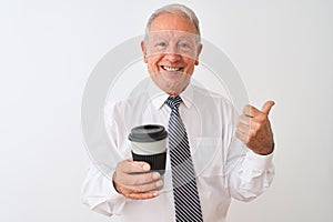 Senior grey-haired businessman drinking take away coffee over isolated white background pointing and showing with thumb up to the