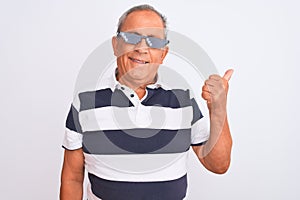 Senior grey-haired man wearing striped polo and sunglasses over isolated white background happy with big smile doing ok sign,