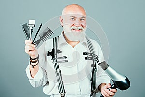 Senior hairdresser. Bearded man, bearded senior in beauty salon. Portrait of stylish hairdresser man with white beard