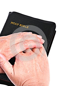 Senior Hands over Bible
