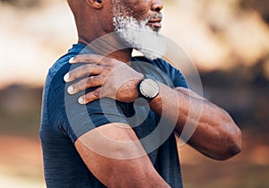 Senior hands, shoulder pain or injury in nature after accident, workout or training. Sports, health or elderly black man