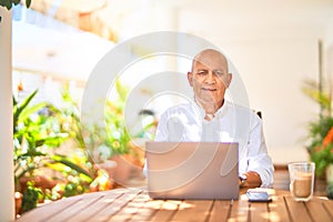 Senior handsome man smiling happy and confident