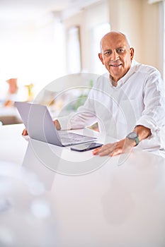 Senior handsome man smiling happy and confident