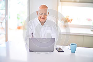 Senior handsome man smiling happy and confident