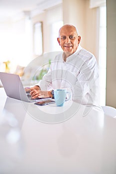 Senior handsome man smiling happy and confident