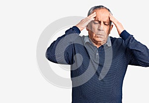 Senior handsome man wearing casual polo with hand on head for pain in head because stress