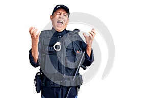 Senior handsome man wearing police uniform crazy and mad shouting and yelling with aggressive expression and arms raised