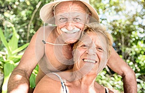 Senior happy couple having fun taking selfie at Thailand trip