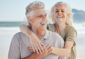 Senior, happy couple and hug on beach in support, love or care for bonding, weekend or break together. Elderly man and