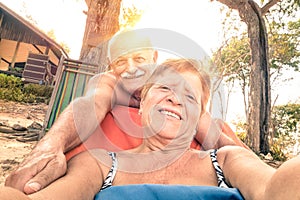 Senior happy couple taking selfie in Thailand trip