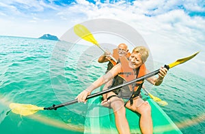 Senior happy couple taking travel selfie on kayak at Ang Thong m