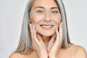 Senior happy middle aged mature asian woman closeup portrait. Skin care advertising.